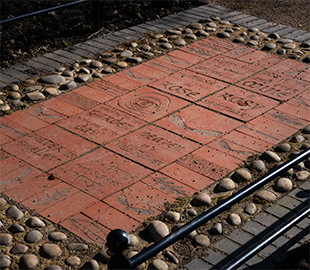 Decorative etched bricks making up a public path