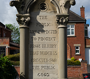 An ornate stone drinking fountain