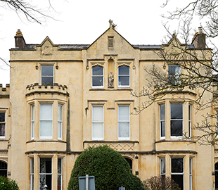 A statue of Hamlet above a Regency Cheltenham building