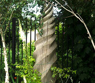 A carved, spiral wooden totem