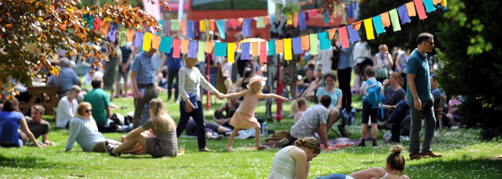 People enjoying the atmosphere in a park during a Festival