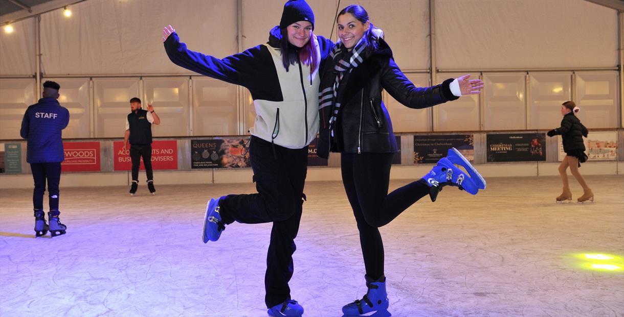 People skating on the ice rink.